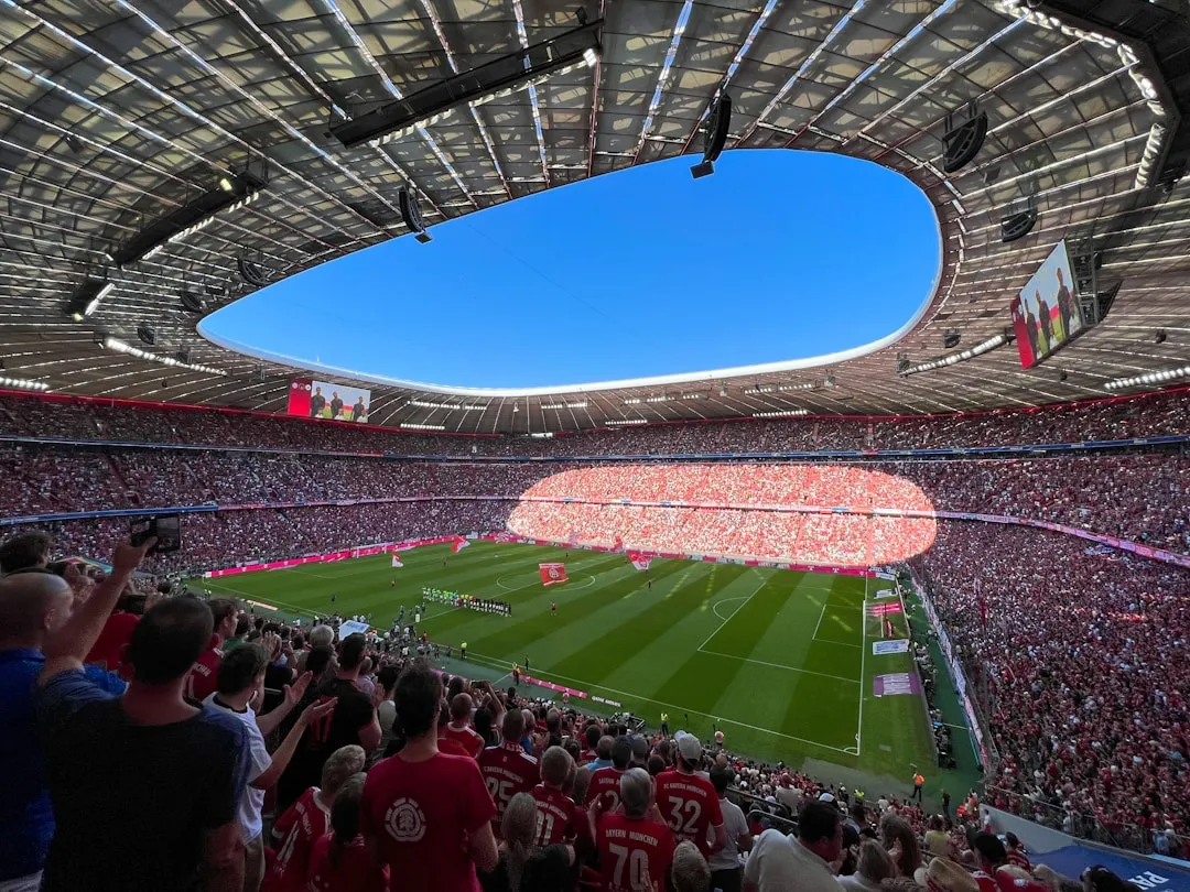 A packed football stadium before a match.